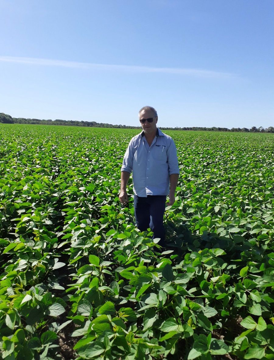Mr. Rubin Weiss standing in a soybean field in Tocantins